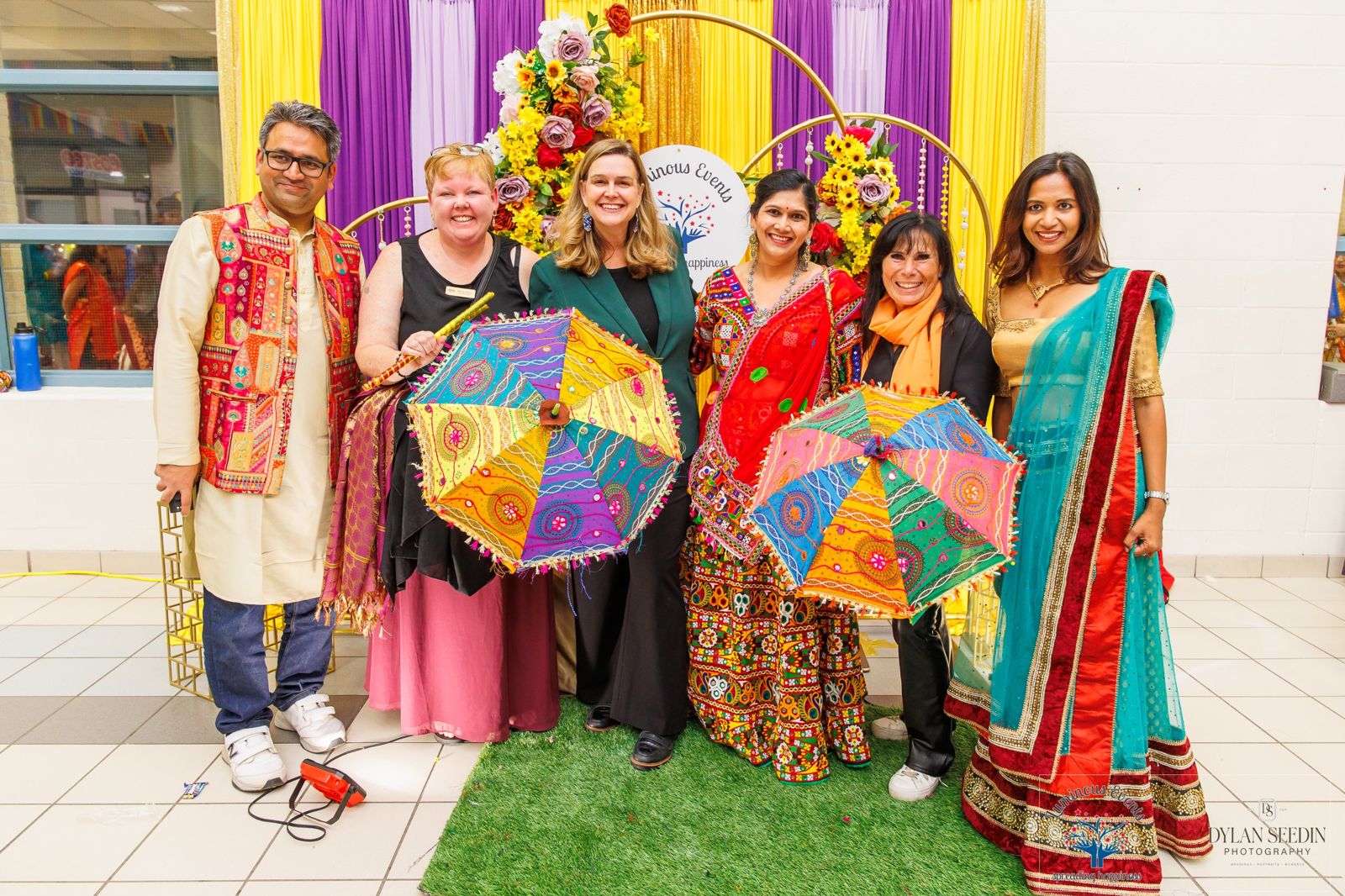 Honoured guests with colourful umbrellas